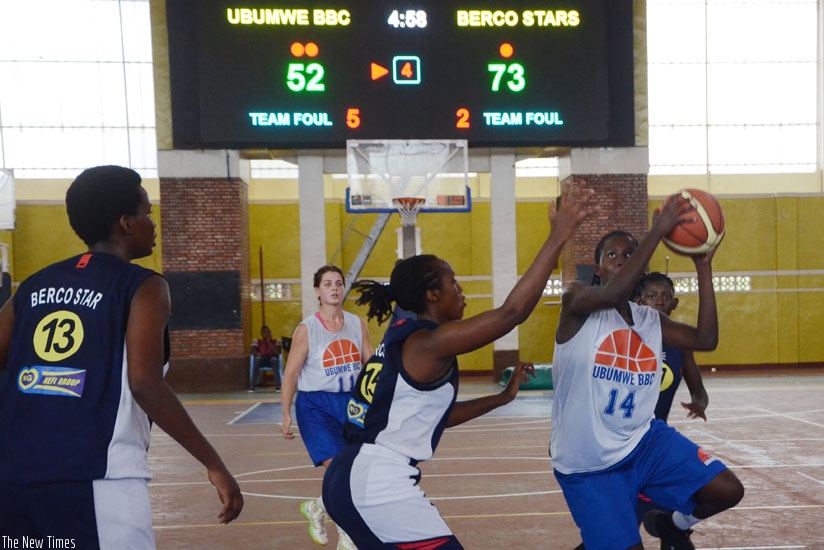 Ubumwe's Nicole Rwibutso (R) goes for a shot against Berco Stars in the opening game of the Zone V Club Championships on Sunday. (S. Ngendahimana)