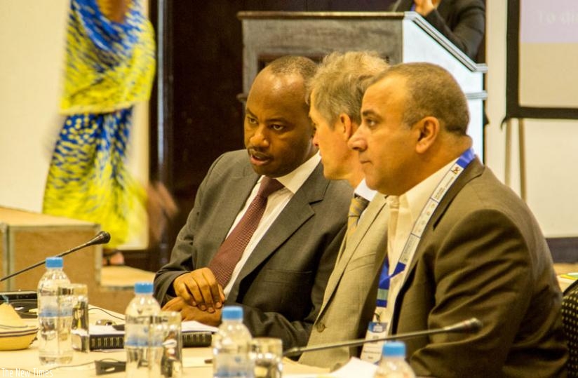Nsengiyumva chats with Arnout Pauwels, the Belgian ambassador to Rwanda (C), as Nasser Qatami, the Palestinian deputy minister in charge of TVET and employment (R), looks on. (Doreen Umutesi)