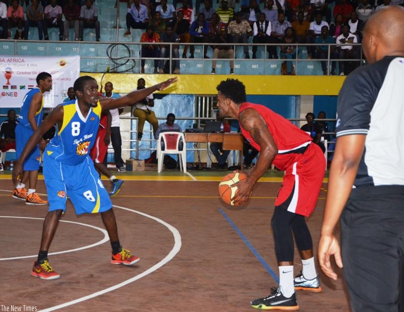 Mike Buzangu of CSK (R) in action against Tiger Head Power of Uganda in a previous game. He scored a game high 36 points in their game against  KPA yesterday. (Sam Ngendahimana)