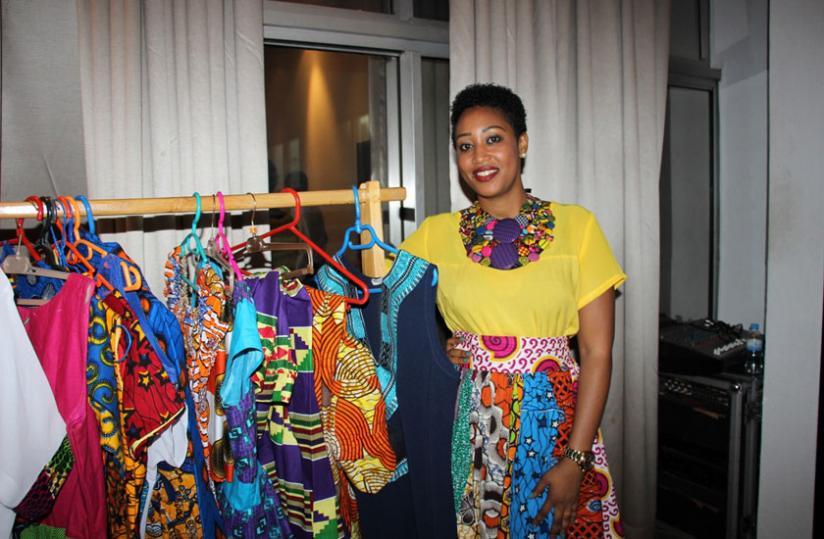 Uwase selling her beautiful and bright outfits at Hotel Des Mille Collines by Kempinski after the Rwanda Cultural Fashion Show 2015.