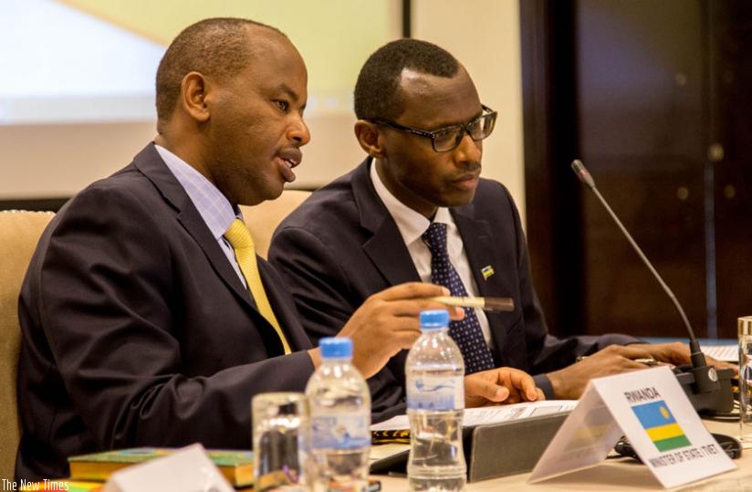 Albert Nsengiyumva, the state minister for TVET (L), and Papias Malimba Musafiri, PhD, the minister for education share ideas at the African Ministerial Conference on TVET in Kigali yesterday. (Doreen Umutesi)