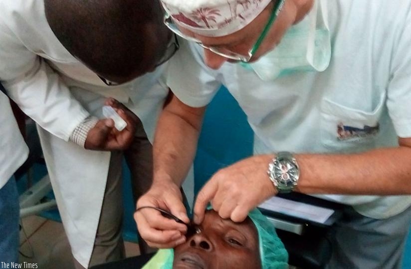 Dr Elina Barraquer, an ophthalmologist, performs a cataract operation on an eye patient in Musanze Hospital during a recent campaign. (File)