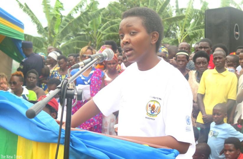 Honirine Uwase Hirwa, who spoke on behalf of girls, addresses the audience during celebrations to mark the International Day of the Girl Child in Fumbwe Sector, Rwamagana District, yesterday. (Stephen Rwembeho)