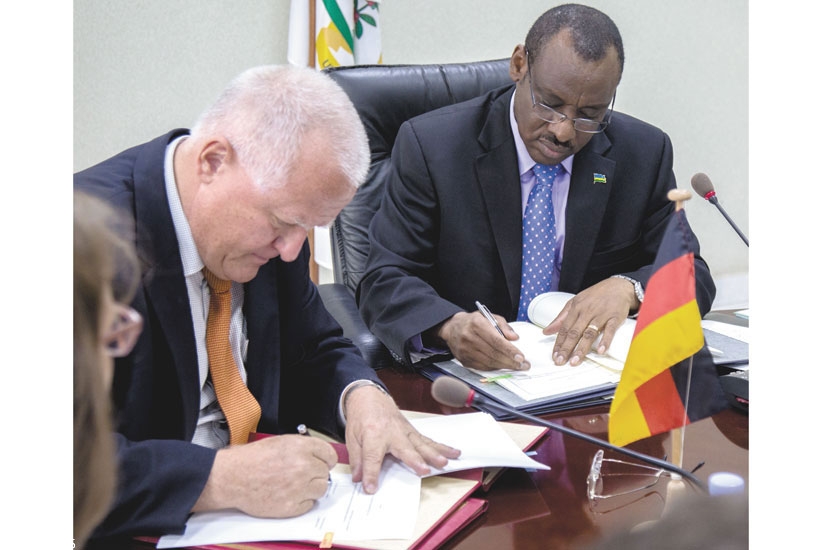 Amb. Fahrenholtz (L) and Finance Minister Claver Gatete sign bilateral agreements in June this year. The two countries have a lot in common. (File)