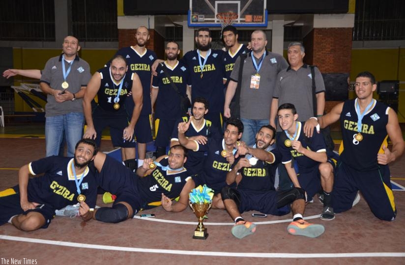 Egyptian side Gezira celebrate after winning the FIBA Zone V Club Championships on Saturday evening at Petit Stade outside Amahoro stadium in Remera. (S. Ngendahimana)