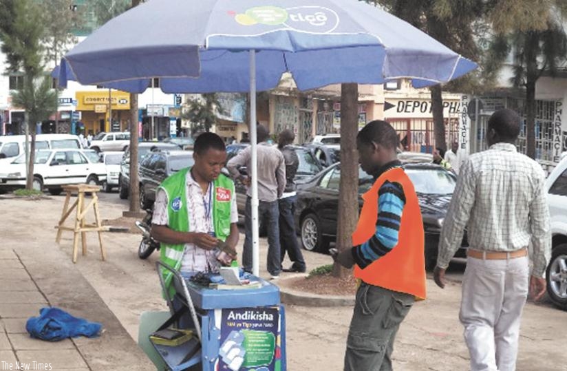 The new platform will allow subscribers on both networks   to send and receive money. (File)