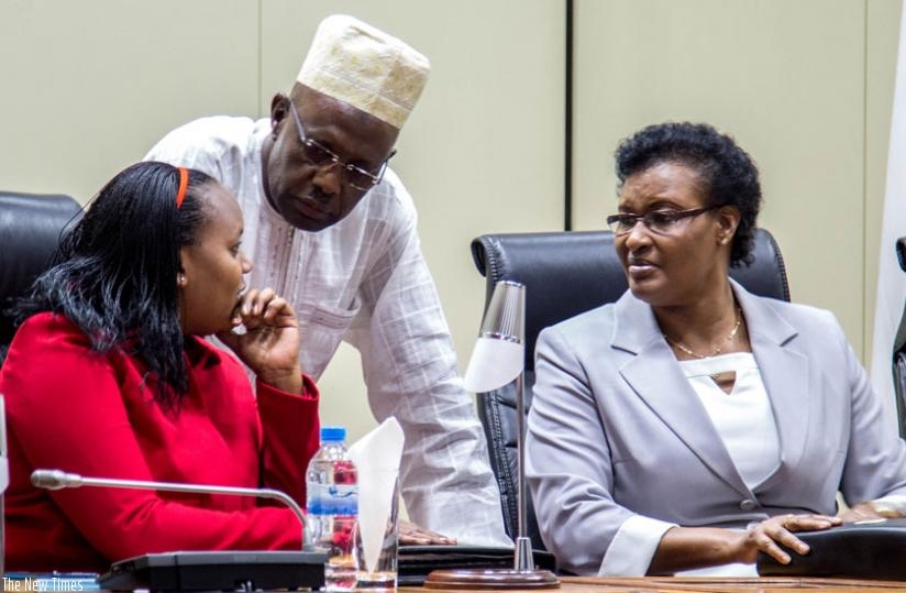 Deputy Speaker of Parliament in charge of Legislation Jeanne d'Arc Uwimanimpaye (L), Deputy Speaker in charge of Administration Abbas Mukama and Speaker Donatile Mukabalisa (R) chat before the opening of the session to discuss the amendment of the Constitution in Parliament yesterday. (Doreen Umutesi)