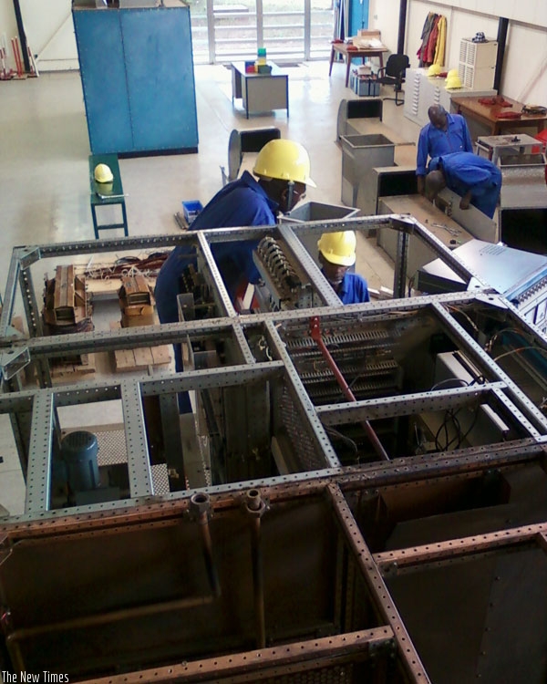 Deutsche Welle workers dismantle equipment at the station in Kigali last month. (Jean d'Amour Mugabo)