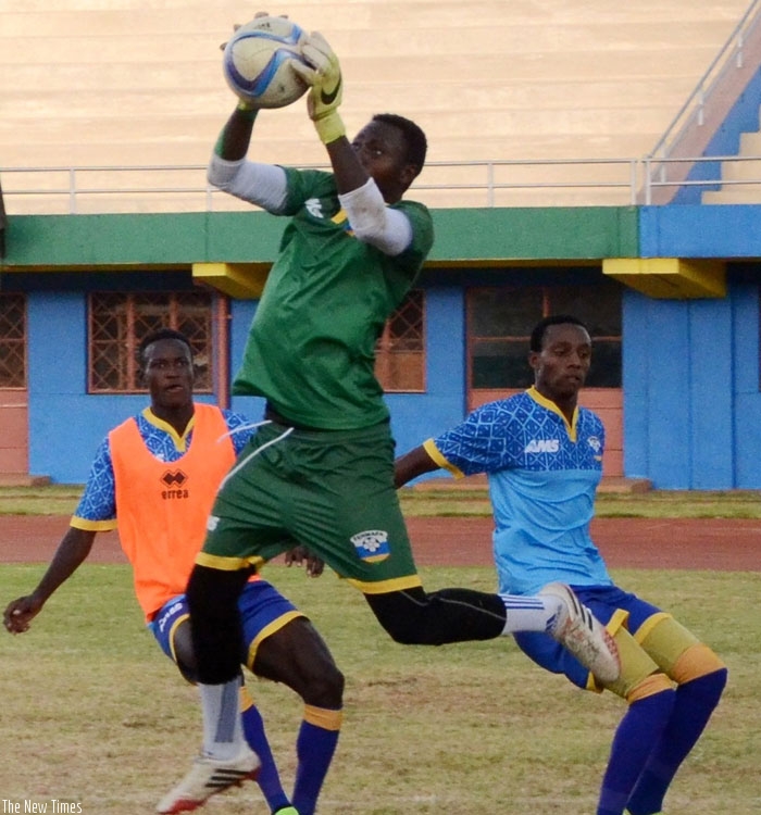 Rwanda CHAN team captain Eric Ndayishimiye goes for a high catch during a training session at Amahoro stadium. (S. Ngendahimana)