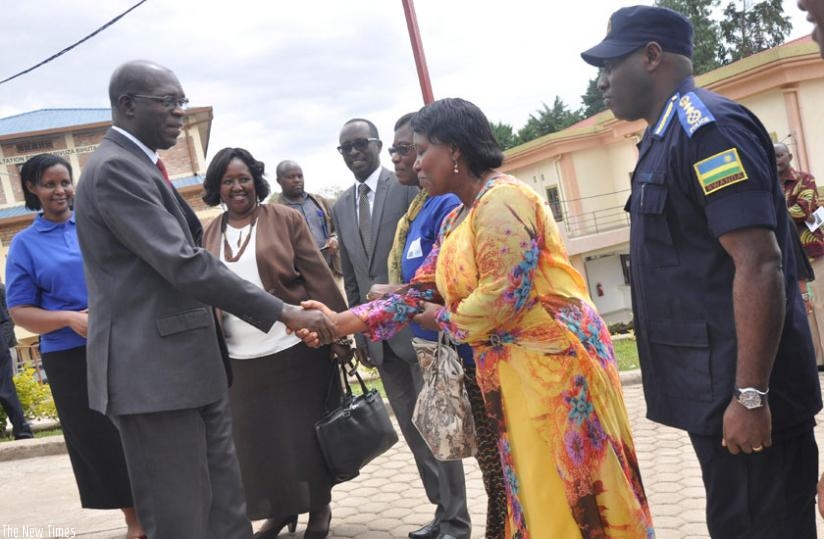 Muhanga District mayor Yvonne Mutakwasuku welcomes premier Murekezi as other government officials look on. This was during  the  launch of the national campaign against gender-based violence and child abuse yesterday. (Courtesy)