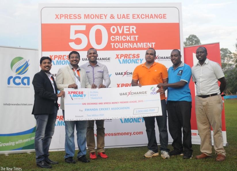 RCA officials receive the dummy-cheque from UAE Exchange. (Courtesy)
