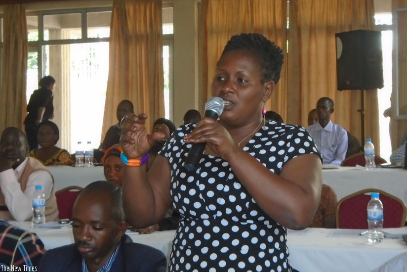 A participant asks a question during the meeting in Huye District, last week. (Courtesy)