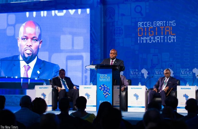 Youth and ICT Minister Jean Philbert Nsengimana (C)speaks during the summit as Dr Fred Matiangi, the cabinet secretary, Ministry of Information, Communications and Technology (ICT)  in Kenya (L ) and Gabon's deputy Prime Minister Flavien Nziengui Nzoundou (R) look on. (Timothy  Kisambira)
