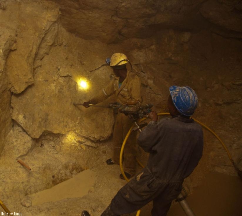 Miners in a tunnel at Gatumba mining centre in Ngororero District. (Timothy Kisambira)