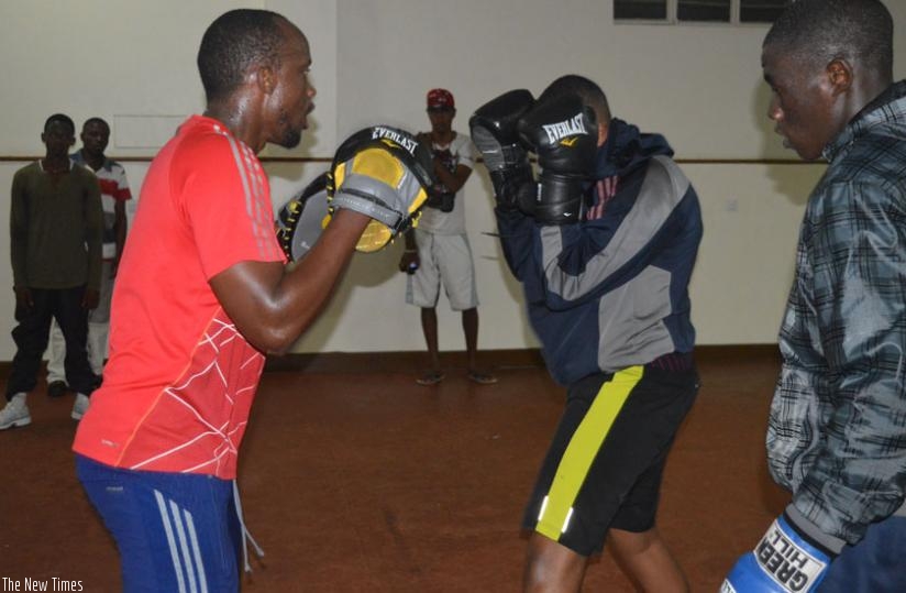 Members of Kigali Life boxing club train at Amahoro stadium gym. (S. Kalimba)