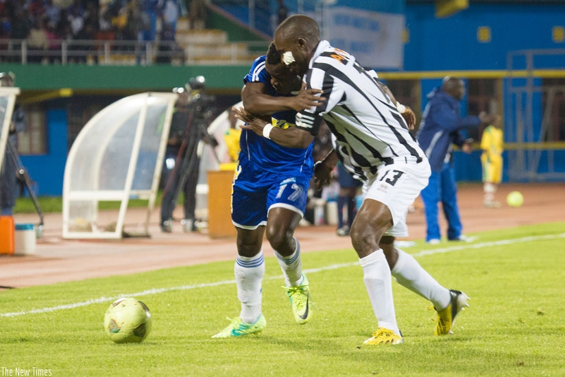 APR skipper Ismail Nshutiyamagara takes on former Rayon Sports striker Peter Otema during last season's second round clash at Amahoro stadium. (File)