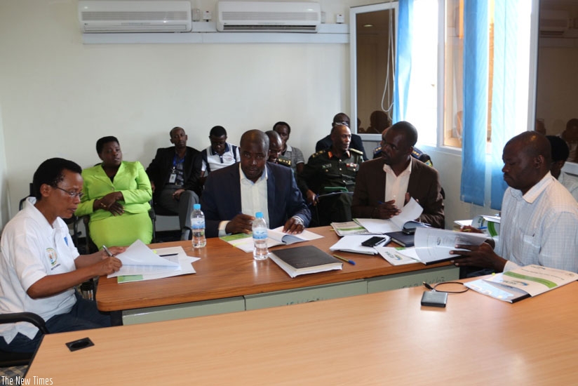 Dr Rose Mukankomeje  signs an MoU to revamp forests with mayors from Nyabihu, Ngororero, Rutsiro and Rubavu. (Jean Fide Ndungutse)