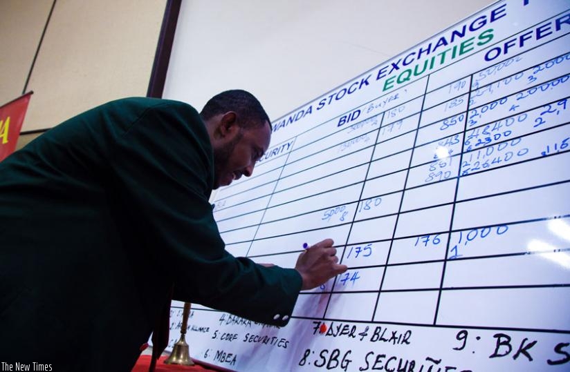 A broker transacts business at the Rwanda Stock Exchange. The new investment fund is hoped to reduce external shocks on the local currency.  (Timothy Kisambira)