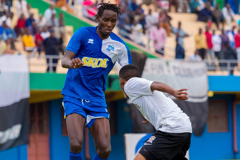 Rayon Sports' Ugandan striker Davis Kasirye, left, tries to go past APR's Eric Rutanga during the league match played on Saturday at Amahoro Stadium. (Timothy Kisambira)