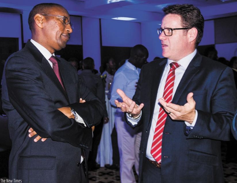 Rwangombwa and Bairstow  chat during the event. I&M Bank unveiled new mortgage products on Thursday. (Teddy Kamanzi)