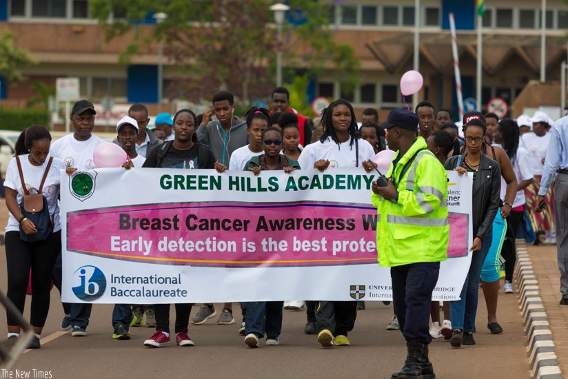 Students of Green Hills Academy join other activists in a cancer awareness march on Sunday. (Timothy Kisambira)