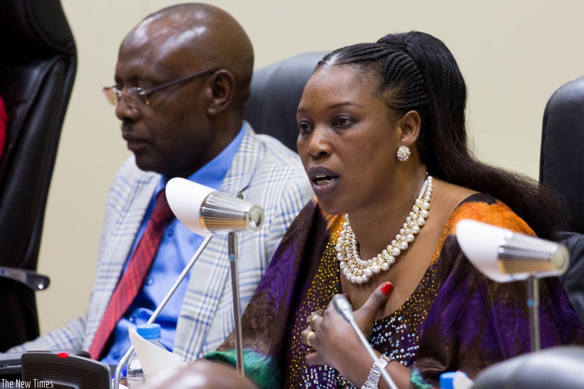 The chairperson of the National Commission for Human Rights, Madeleine Nirere, briefs Parliament on the state of human rights in Rwanda for the 2013-2014 period yesterday as the Deputy Speaker, Abbas Mukama, looks on. (T Kisambira)