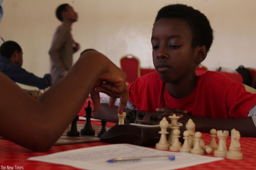 Ian Murara (R) battled for a draw against Alain Patience Niyibizi. The teenager is considered one of the countryu2019s promising stars. (Courtesy)