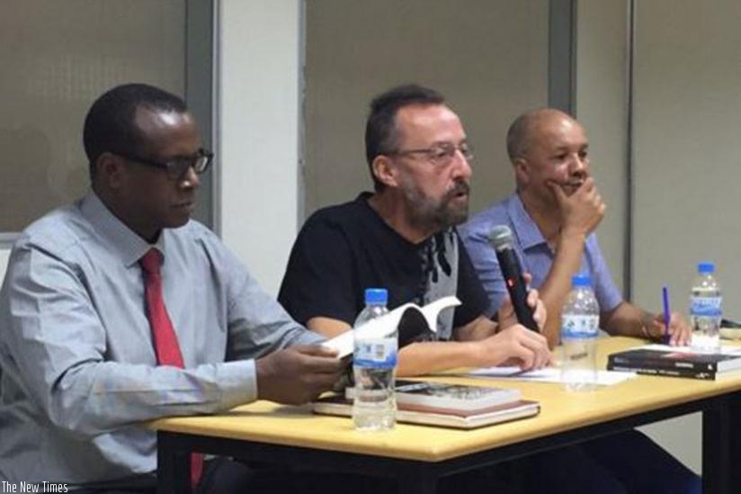 rnPhilippe Brewaeys (C), a Belgian journalist and author, speaks  at the launch of two books about Genocide against Tutsion Wednesday.  With him are Dr Bizimana (L) and fellow author Toch. (Jean du2019Amour Mugabo)