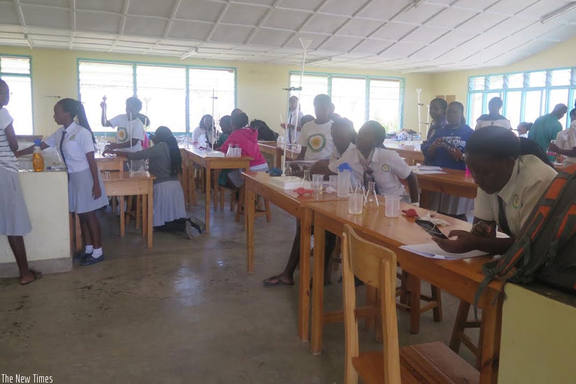 Senior Six students doing a chemistry practical last week. Doing practicals helps students understand concepts better. (All photos by Elizabeth Buhungiro)
