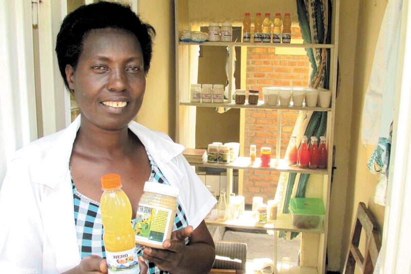Nyirantwali displays some of her packed juices at her home in Cyanika. The businesswoman makes different types of juices. (Denis Agaba)