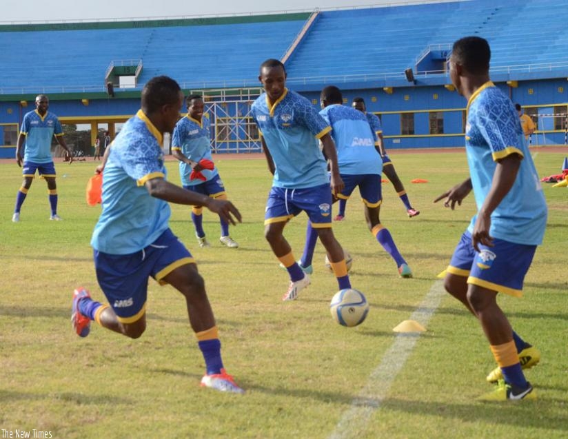 Amavubi players, led by captain Haruna Niyonzima (L) during a past training session at Amahoro stadium. (S. Ngendahimana)