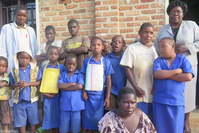 Mukamwezi (right ) with some of the pupils and adults she takes care of at Lamisercobe Primary School.  (All photos by Shamim Nirere)