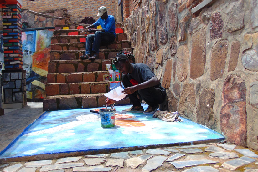 Rukundo and Umuhire working on some of the artworks at Ivuka Arts Studio. (All photos by Julius Bizimungu)