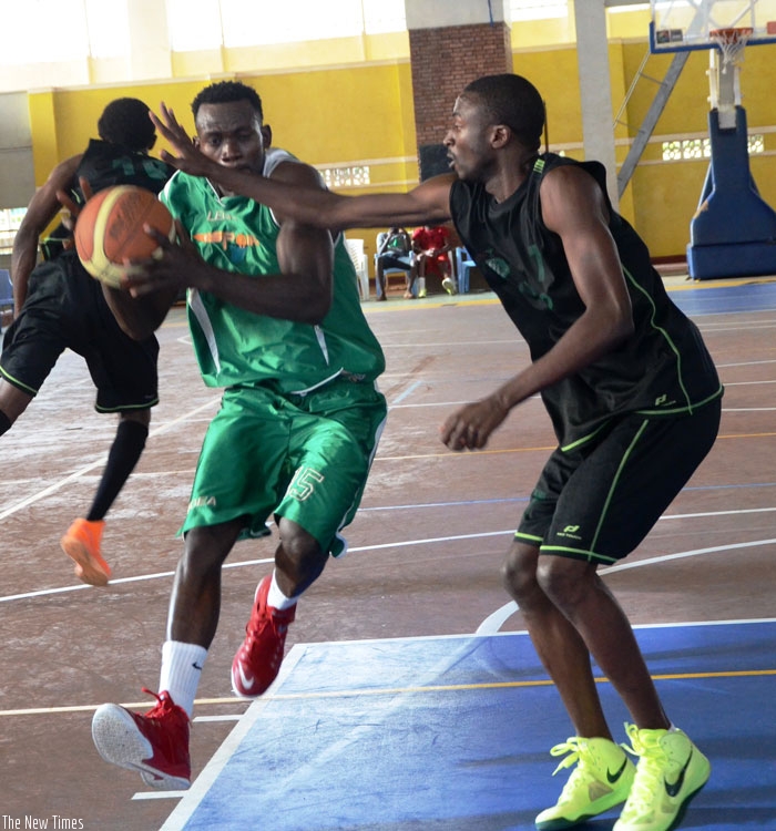 Bienvenue Ngandu, left, remains Espoir's key player heading into the new season. )S. Ngendahimana)