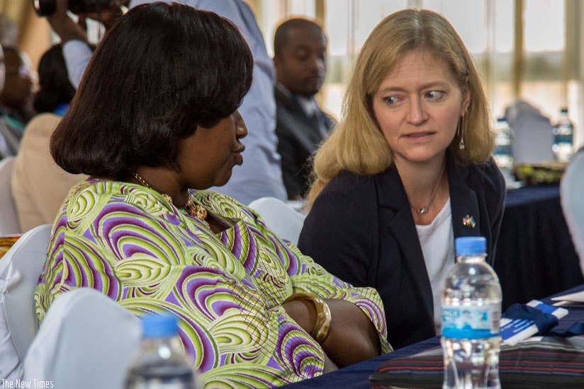 The United States ambassador to Rwanda, Erica Barks Ruggles (R), chats with Dr Agnes Binagwaho, the Minister for Health during the launch of a new Maternal and Child Survival Programme in Kigali yesterday. (All photos by Doreen Umutesi)