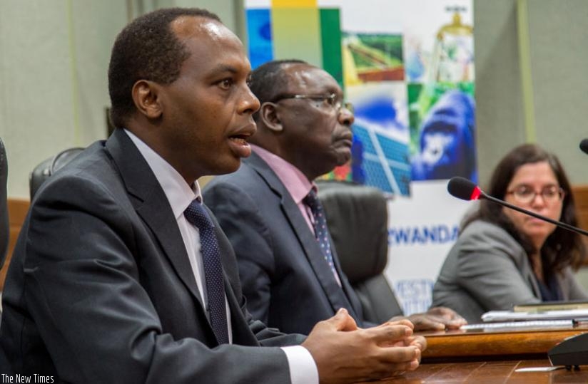Gatare (L) speaks about the report as Kanimba (C) and Ramalho look on. (Doreen Umutesi)