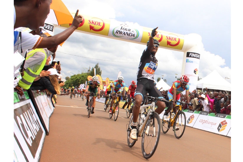Debesay celebrates as he crosses the finish line  en-route to winning stage one of Tour du Rwanda 2015 on Monday. (P. Kamasa)