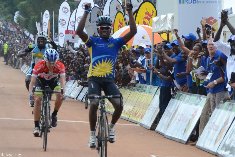 Emile Bintunimana celebrates on crossing the finish line  during stage two of the Tour du Rwanda 2015 on Tuesday. rn(All photos by Sam Ngendahimana)