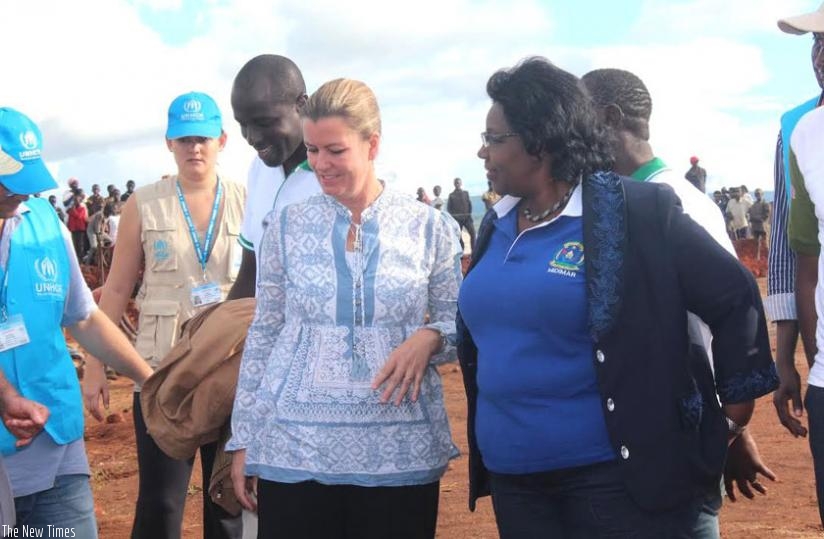 Minister Mukantabana (R), UNHCR deputy high commissioner Kelly Clements (C) and other officials tour Mahama camp on Tuesday. (Stephen Rwembeho)