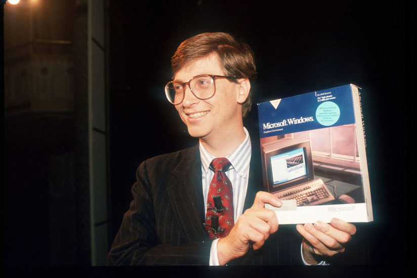 Microsoft co-founder Bill Gates with a boxed copy of Windows. (Carol Halebian)