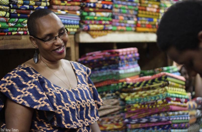 One of the Rwandan designers stands in front of her stall. (Sarine Arsalanian)