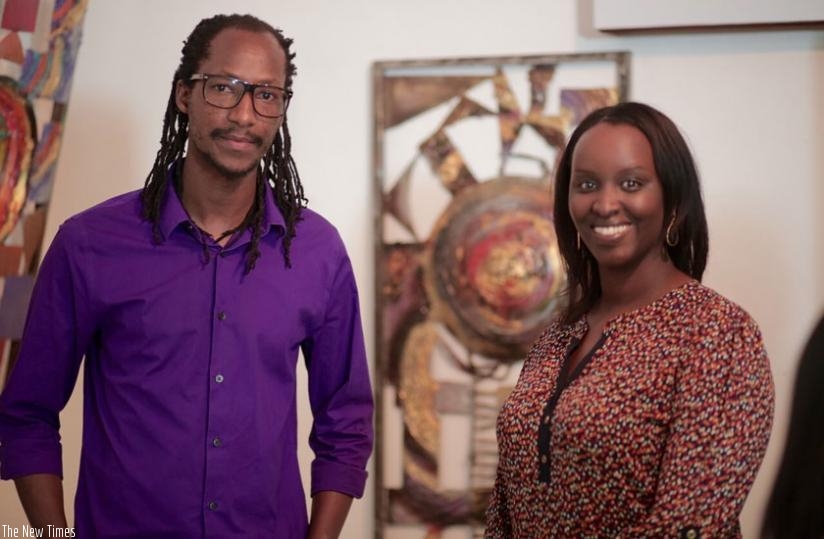 Nkurunziza poses for the camera with one of his art fans. (Joseph Oindo)