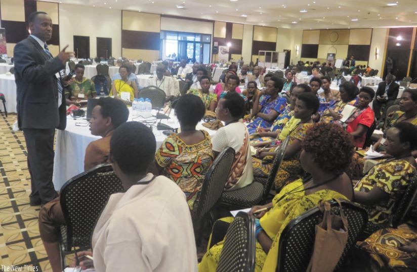 Muhimuzi speaks during the training workshop.  The women were trained in planning and budgeting in coffee production. (Michel Nkurunziza)