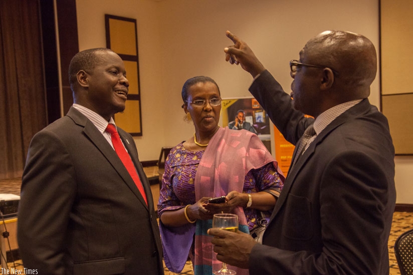 Hon. Daniel Fred Kidega (L), Speaker of the East African Legislative Assembly, Amb. Valentine Rugwabiza (C), Minister for East African Affairs, and Denis Karera, Chairman of the East African Business Council, share a light moment during a dinner at Serena Hotel recently. The Private Sector Federation has asked EALA to pass laws that favour smooth trade in the region. (Faustin Niyigena)