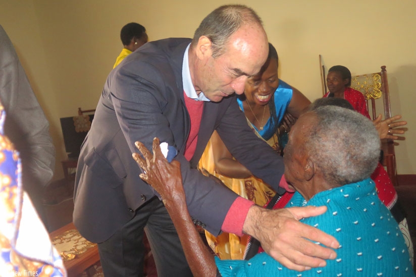 Bralirwa CEO, Jonathan Hall embraces one of the widows (Courtesy photos)
