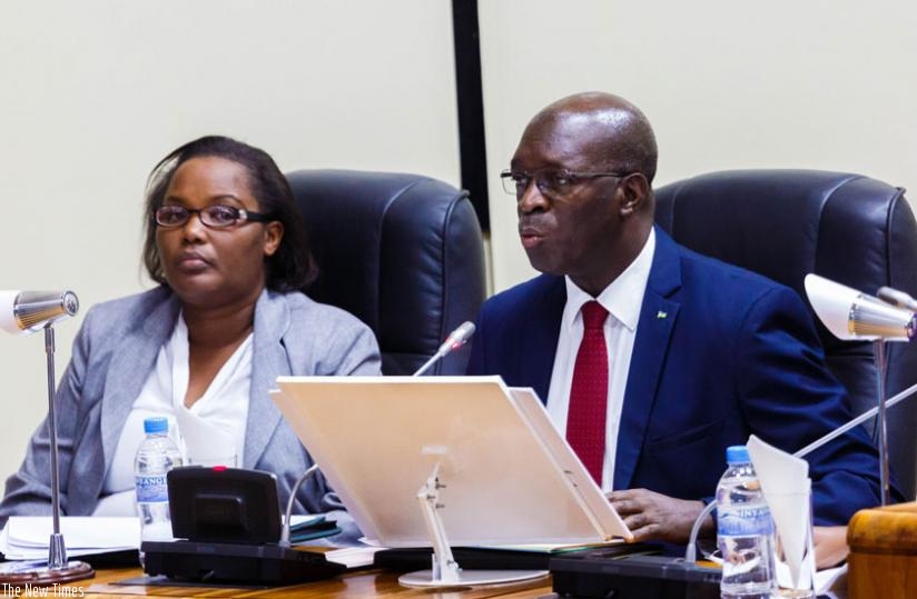 Premier Murekezi presents a report on agriculture sector performance over the last five years as Agriculture minister Geraldine Mukeshimana listens at Parliament yesterday. (Timothy Kisambira)
