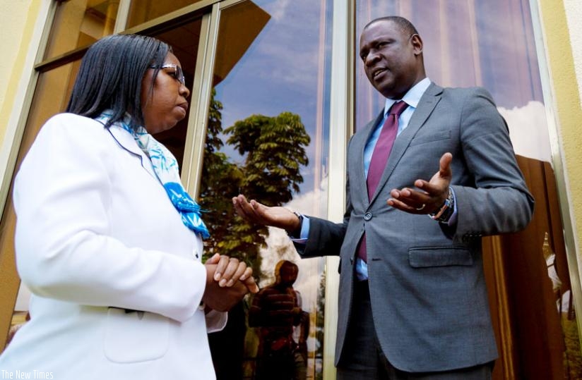 Chief Ombudsman Aloysie Cyanzayire (L) chats with the Chairperson of Private Sector Federation, Benjamin Gasamagera, after officiating at an anti-corruption event in Kigali yesterday. (Timothy Kisambira)