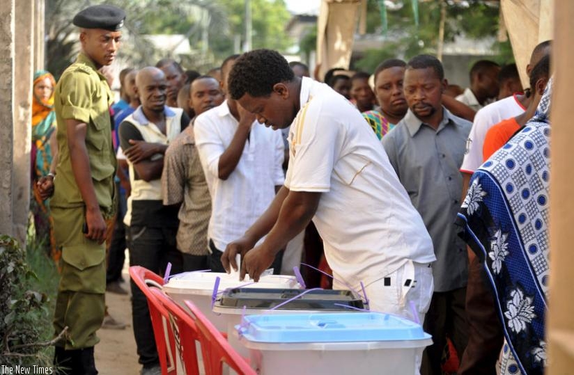 A man casts his ballot at a polling station during the recent presidential elections in Tanzania. (Net photo)