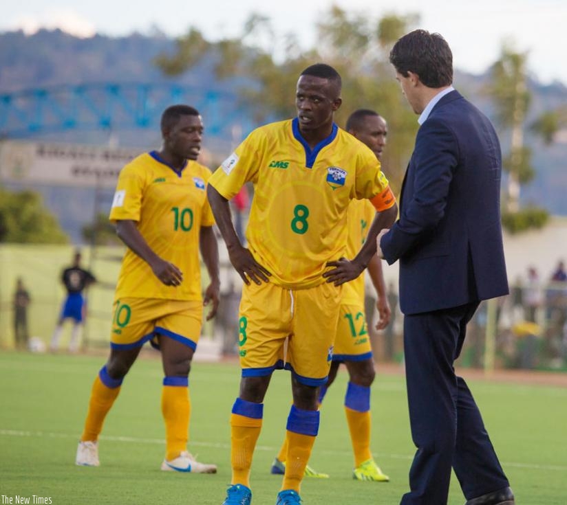 McKinstry speaks to Amavubi captain Haruna Niyonzima during a 2018 World Cup qualifier against Libya in Kigali last month. The Amavubi face Uganda Cranes in CECAFA in Ethiopia today. (Timothy Kisambira)