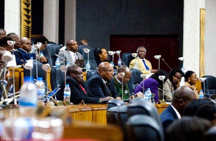 Members of Parliament follow proceedings in the Lower House yesterday. (Timothy Kisambira)